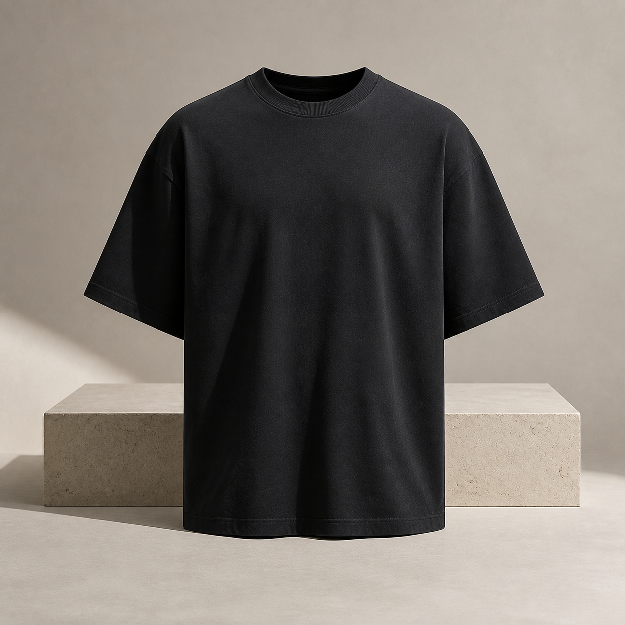 Heavyweight black T-shirt in a warm minimal studio
